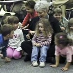 Image extracted from a SongWorks video showing Peggy Bennet surrounded by children